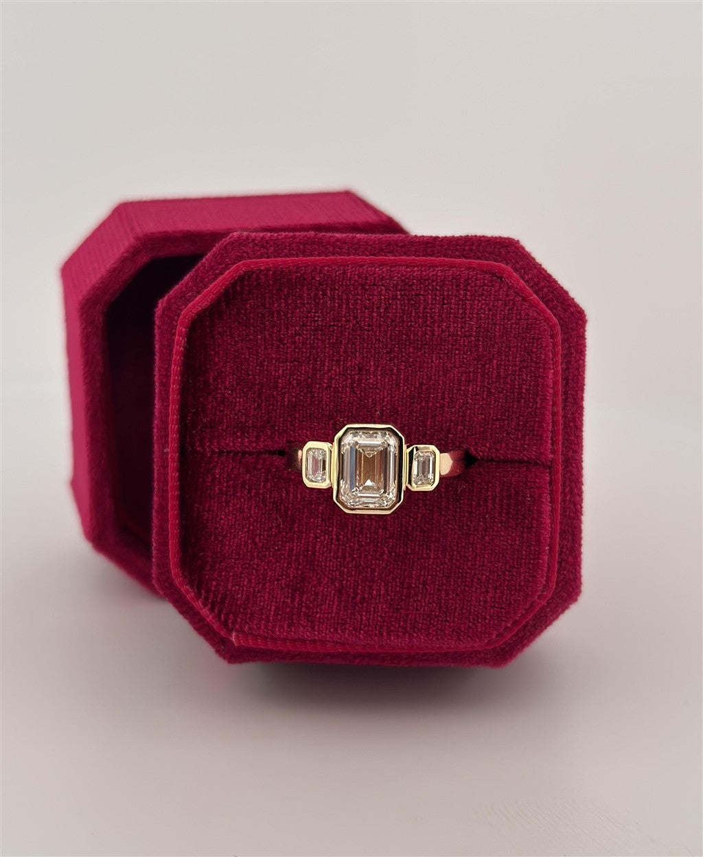 Yellow Gold 3 Stone Bezel Set Emerald Cut Lab Grown Engagement Ring