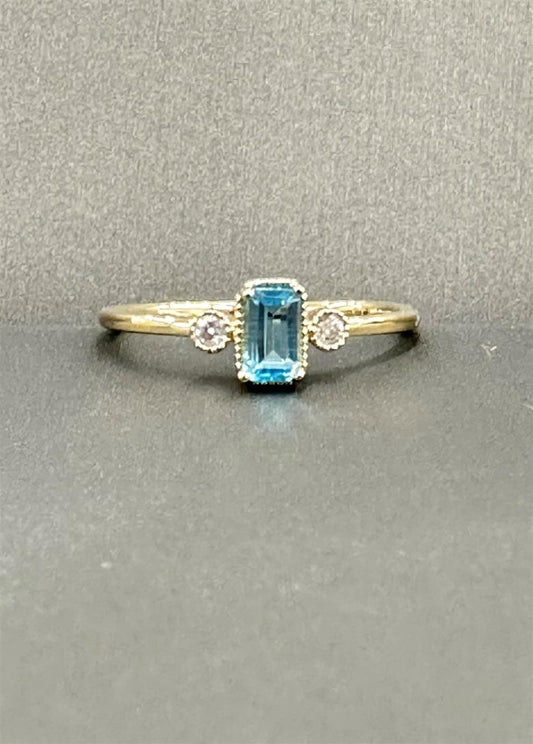 Yellow Gold Emerald Cut Blue Topaz Ring